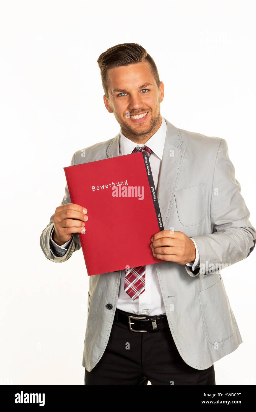 A young man with an application briefcase in the hand. Imagination with a personnel manager, Ein junger Mann mit einer Bewerbungsmappe in der Hand. Vo Stock Photo