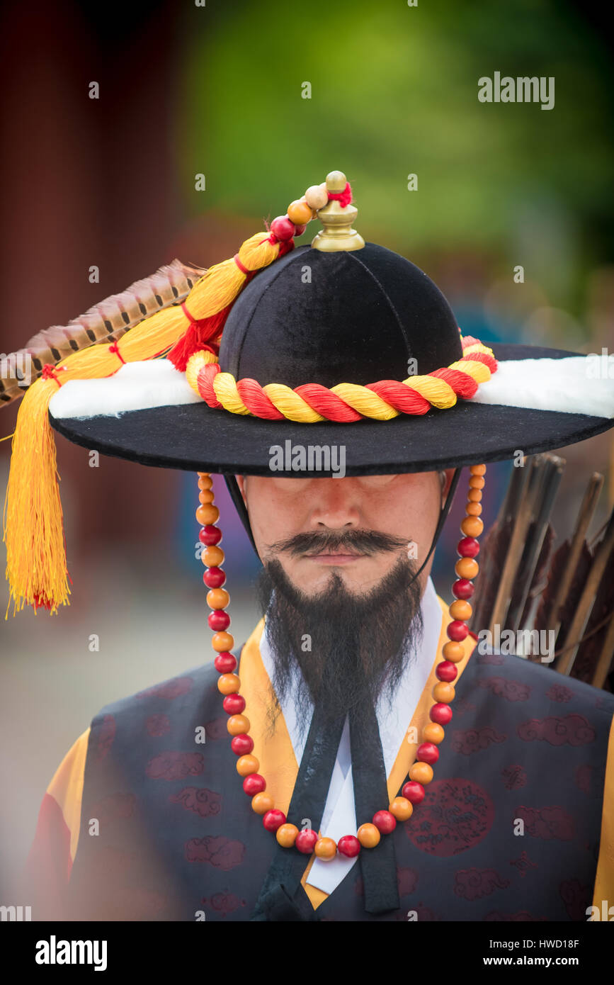 A stoic korean guard outside a palace Stock Photo