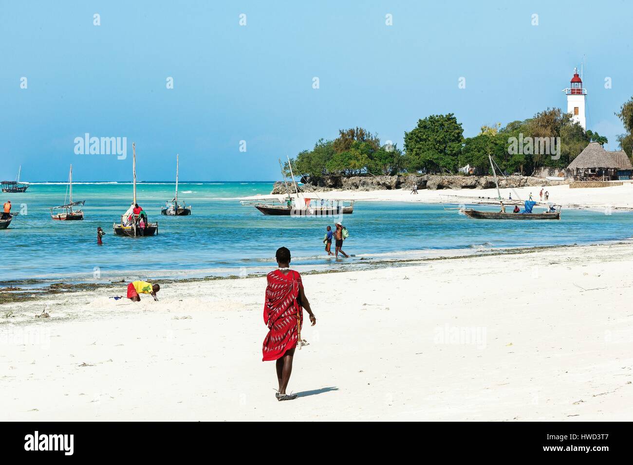 Tanzania, Zanzibar, Nungwi, Masai on the beach of a coastal village Stock Photo