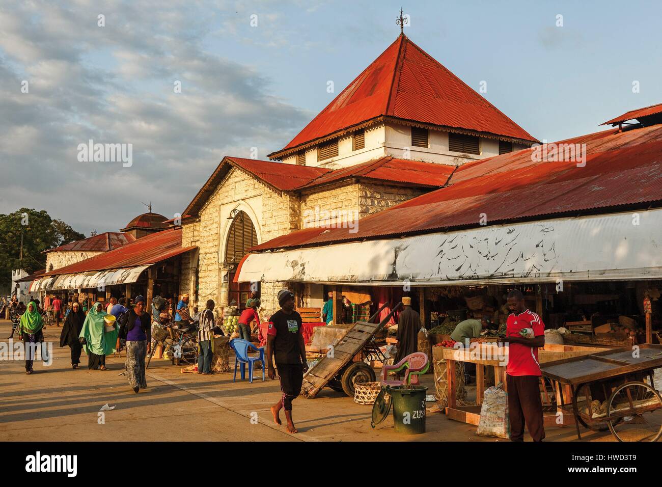 Tanzania, Zanzibar, Zanzibar City, Stone Town, listed as World Heritage by UNESCO, crowd in front of the facade of the market at sunrise Stock Photo