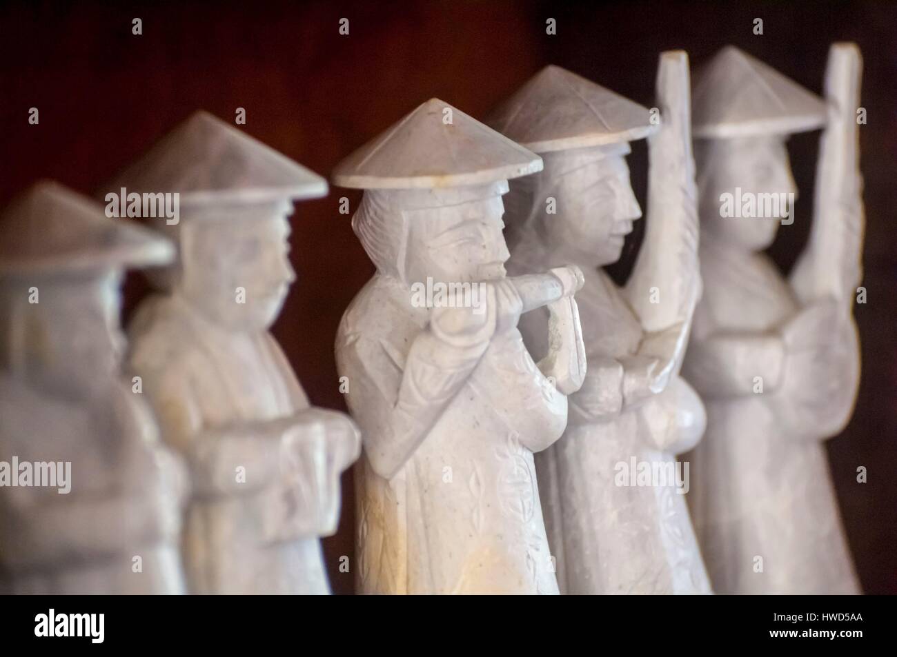 Vietnam, High Tonkin, province of Lao Cai, Sa Pa town, traditional musicians statuettes of a sculptor craftsman in his workshop Stock Photo