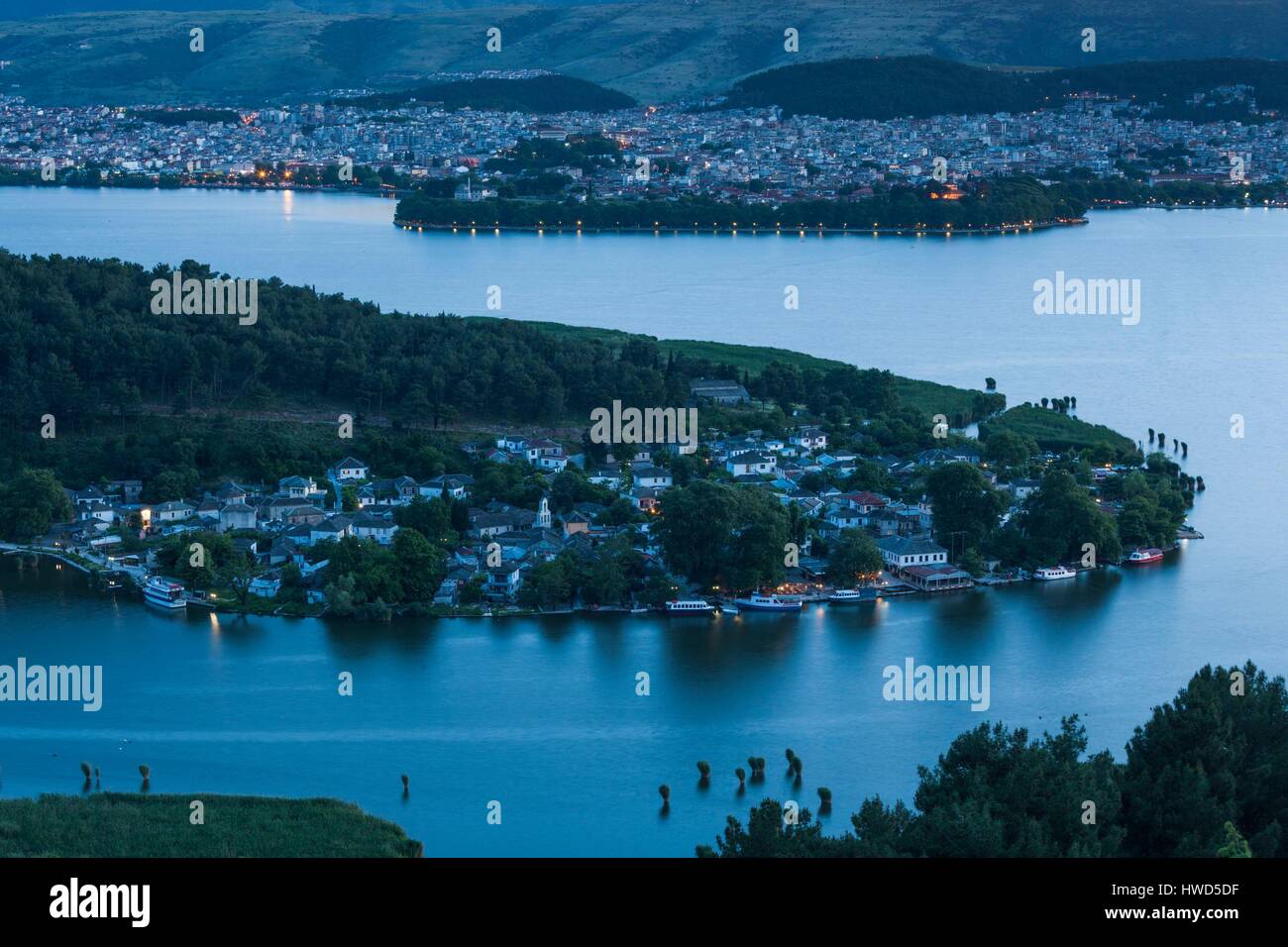 Greece, Epirus Region, Ioannina, elevated city view, Lake Pamvotis and Nisi Island, dusk Stock Photo
