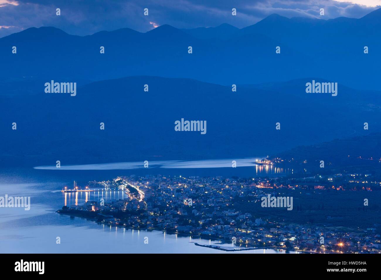 Greece, Central Greece Region, Itea, elevated view of town and Gulf of Corinth, dusk Stock Photo