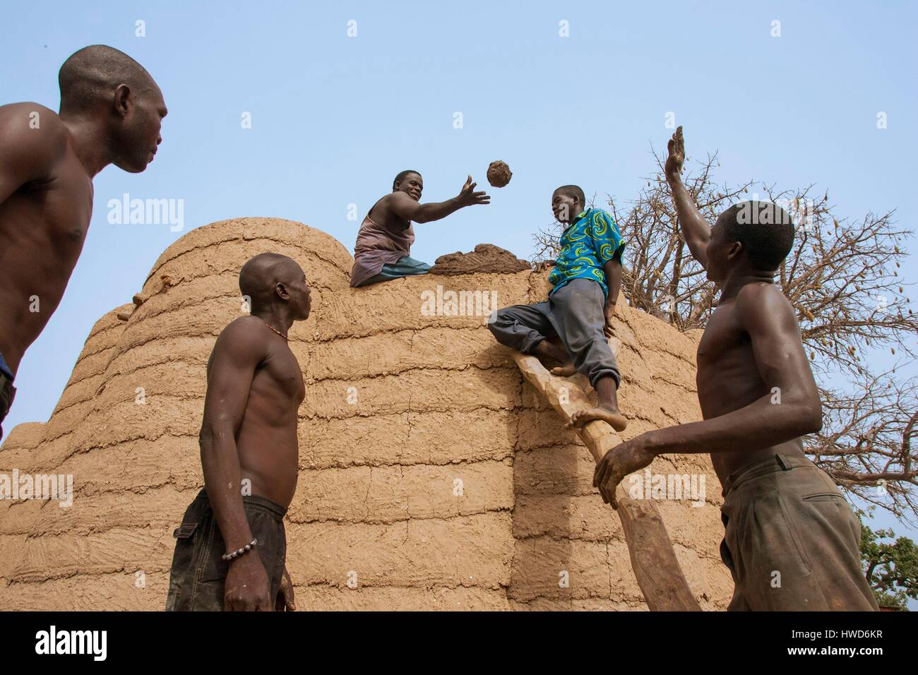 Togo, northern region, Tamberma building a house Tata in clay, listed as a World Heritage of