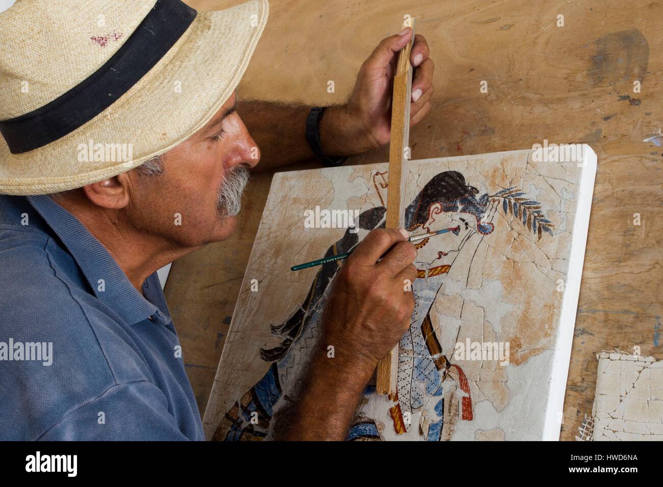 Greece, Cyclades, Santorini, painter making a copy of ancient Thera fresco Stock Photo