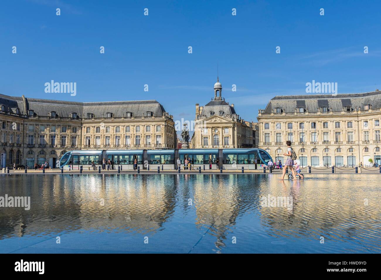 France, Gironde, Bordeaux, area listed as World Heritage by UNESCO, 18th century Bourse square, The Miroir d'eau (Water Mirror), 2006 work by the fountain maker Jean-Max Llorca, architect Pierre Gangnet and urbanist Michel Corajoud, C line tramway Stock Photo