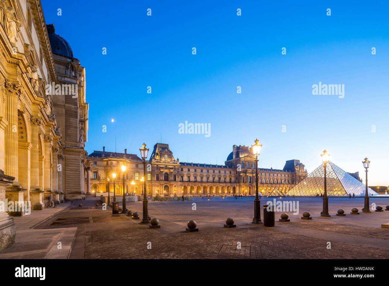 France, Paris, area listed as World Heritage by UNESCO, the Louvre Pyramid by the architect IM Pei and facade of the Cour Napoleon Stock Photo
