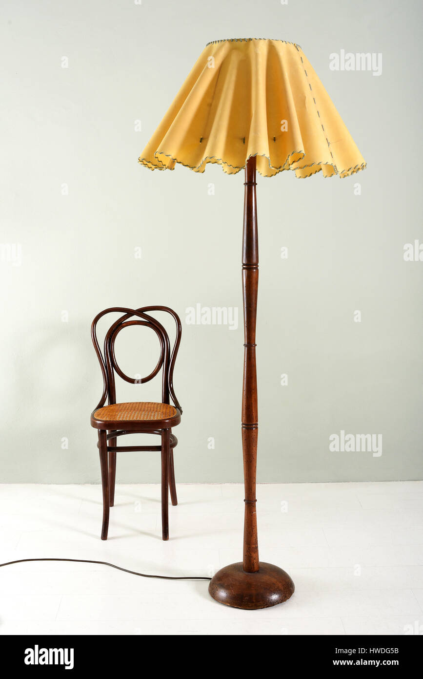 https://c8.alamy.com/comp/HWDG5B/furniture-still-life-of-floor-lamp-with-wood-base-and-decorative-ruffled-HWDG5B.jpg