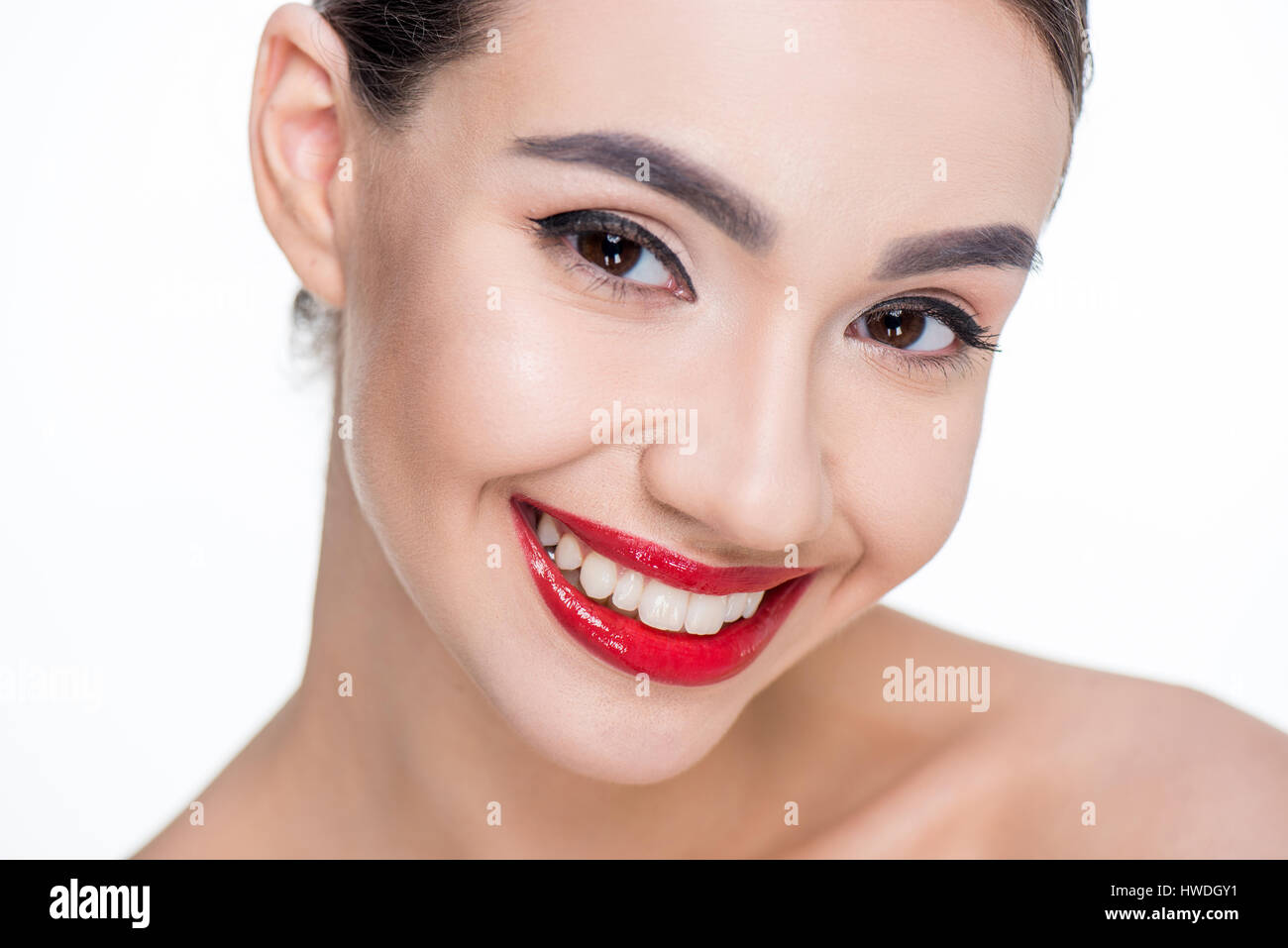 portrait of smiling woman with red lips on white Stock Photo