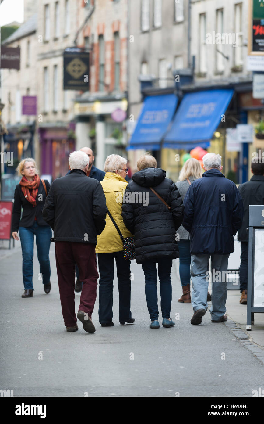 People walk down Black Jack Street, Cirencester in the Cotswolds, Gloucester, England, UK Stock Photo