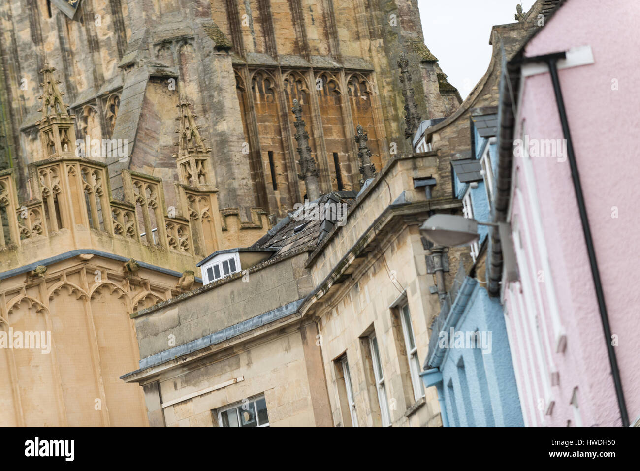 Colourful buildings and St John the Baptist parish church in Market Square, Cirencester in the Cotswolds, Gloucester, England, UK Stock Photo