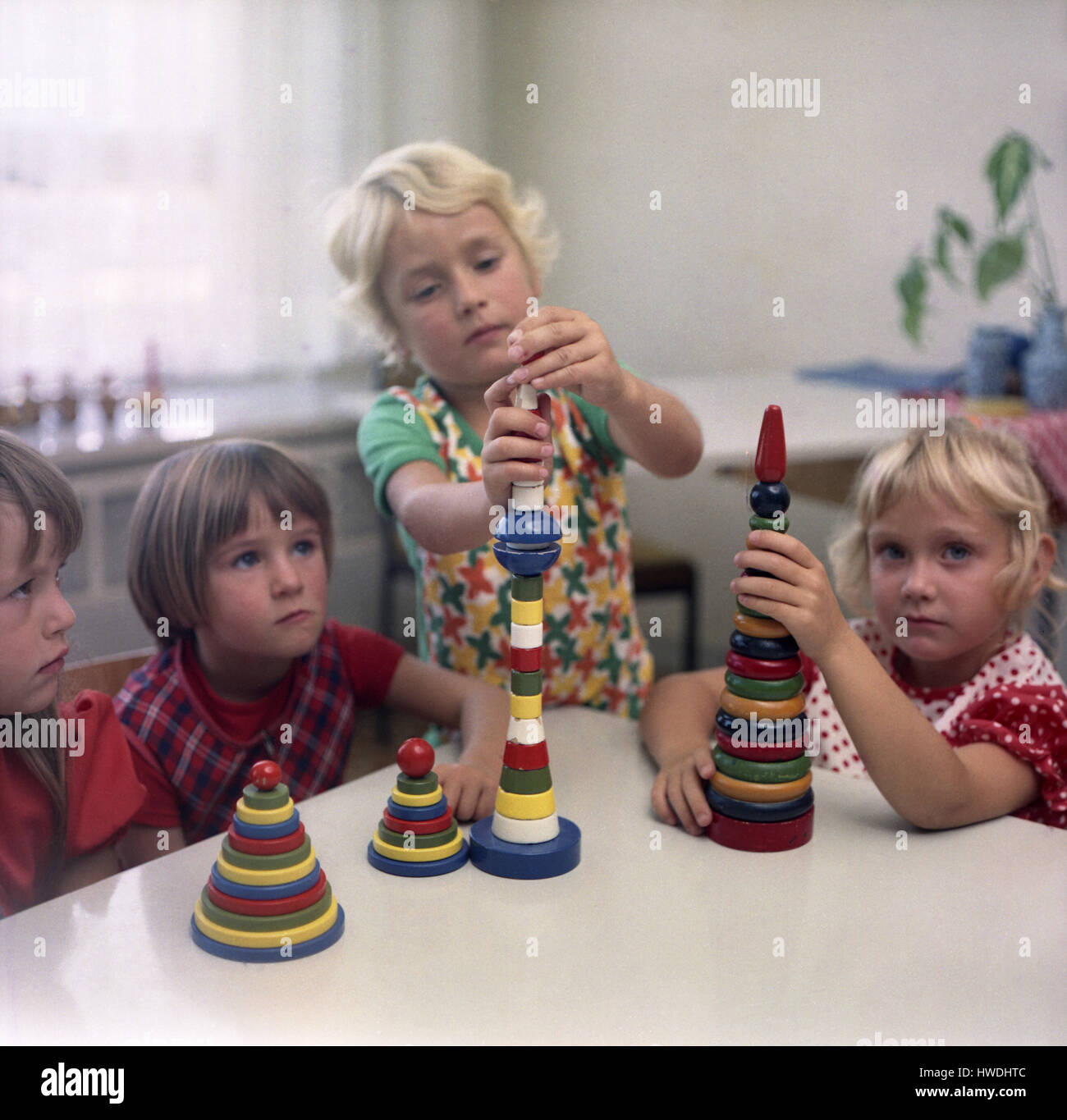Eisenach, GDR, kindergarten children play with building blocks Stock