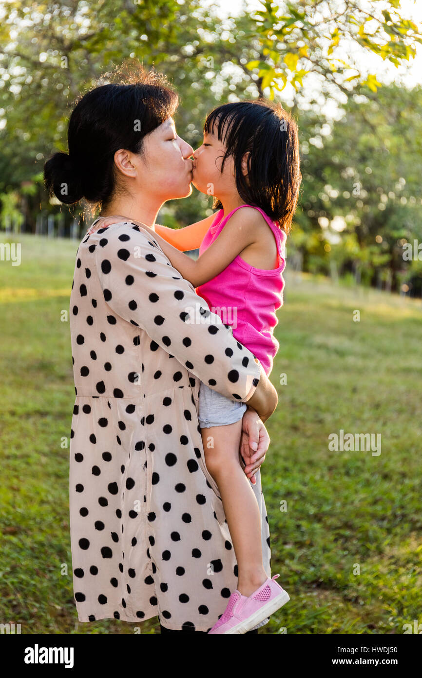 Happy of Mother and Daughter Woman Asian and Aunt with Gift with Pink  Ribbon and Daughter Kissing Mother Stock Photo - Image of asian, female:  119920684