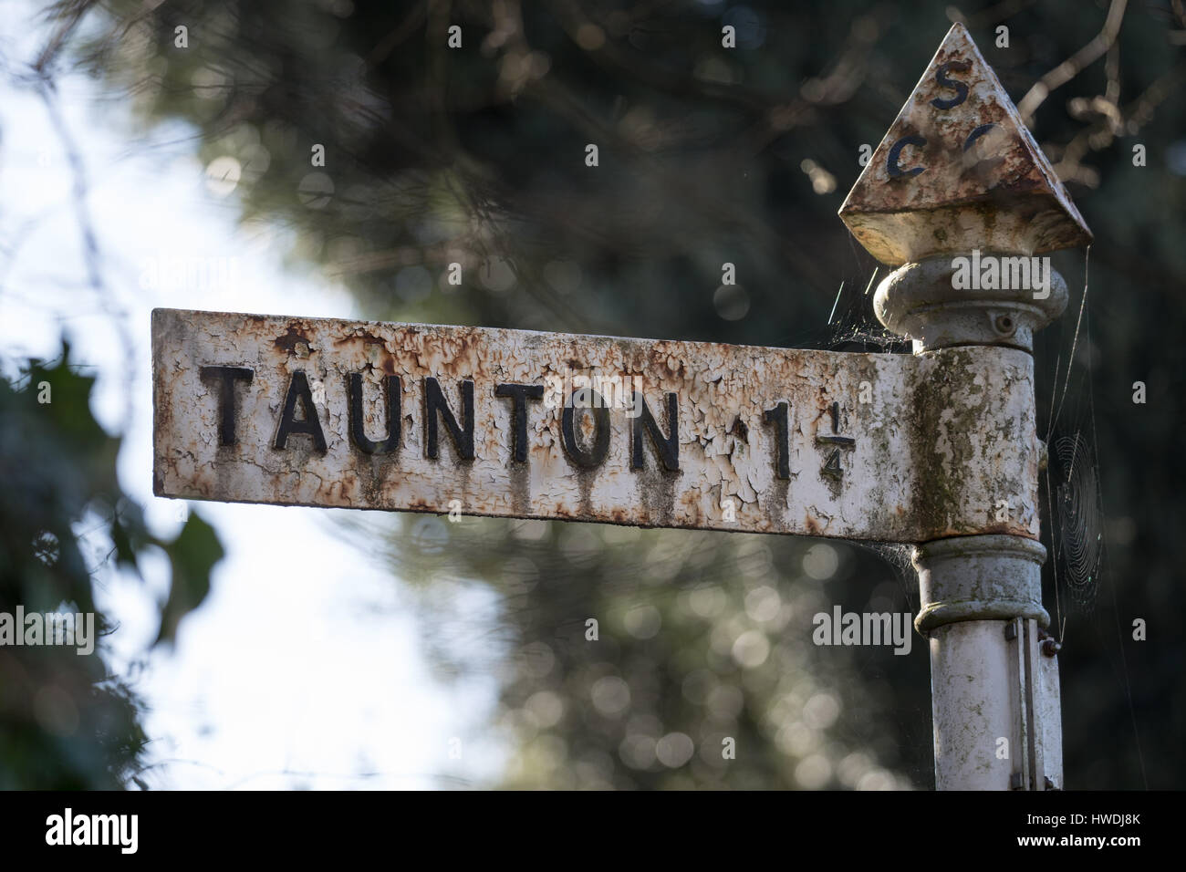 A road sign indicating the direction to the town of Taunton and the distance of one and a quarter miles. Stock Photo