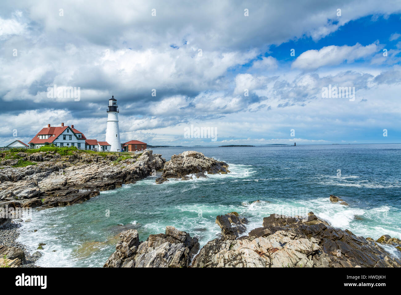 Portland Head Light is a historic lighthouse in Cape Elizabeth, Maine. The light station sits on a head of land at the entrance of the primary shippin Stock Photo