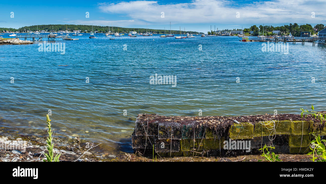 Lobster traps wait along the shore of West Boothbay Harbor at Cape