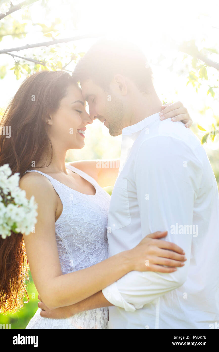 Young couple in love kissing and hugging in nature Stock Photo - Alamy