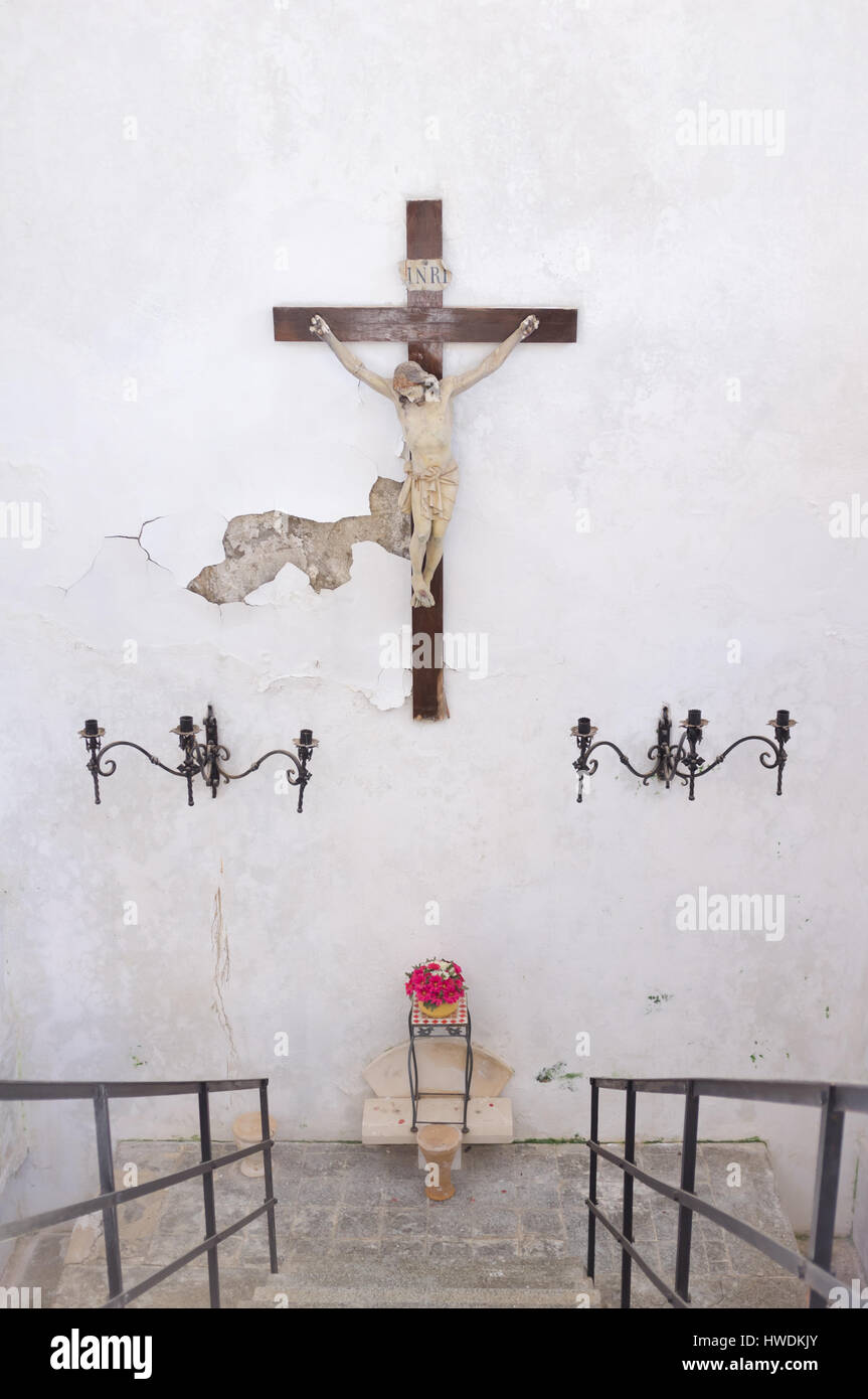 Crucifix on the wall of a crypt in Soller, Mallorca, Spain. Stock Photo