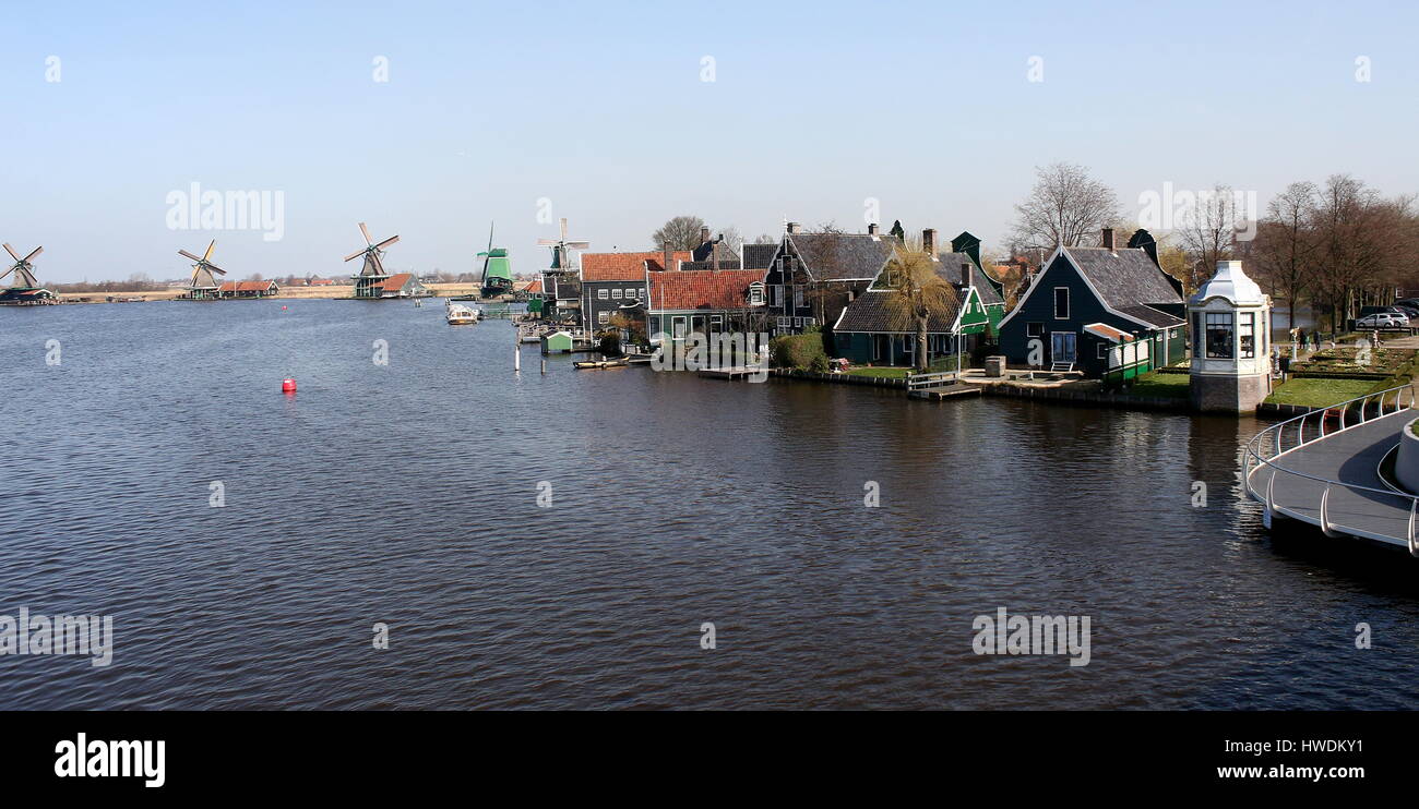 Traditional Dutch wooden houses and historical windmills at the village of Zaanse Schans, Zaandam / Zaandijk, Netherlands Stock Photo