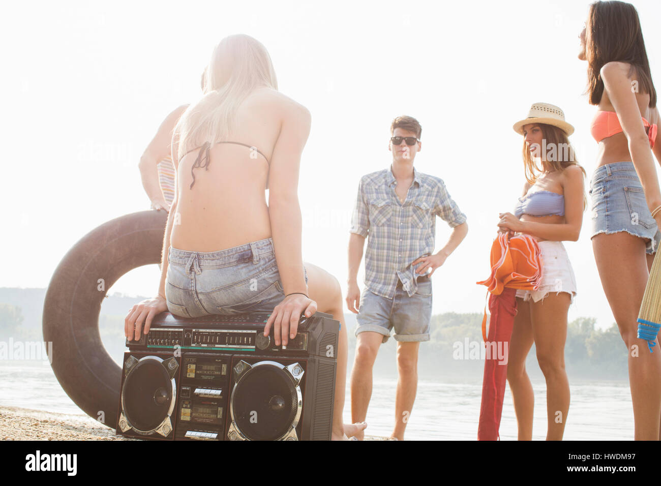 Group of friends enjoying beach party Stock Photo
