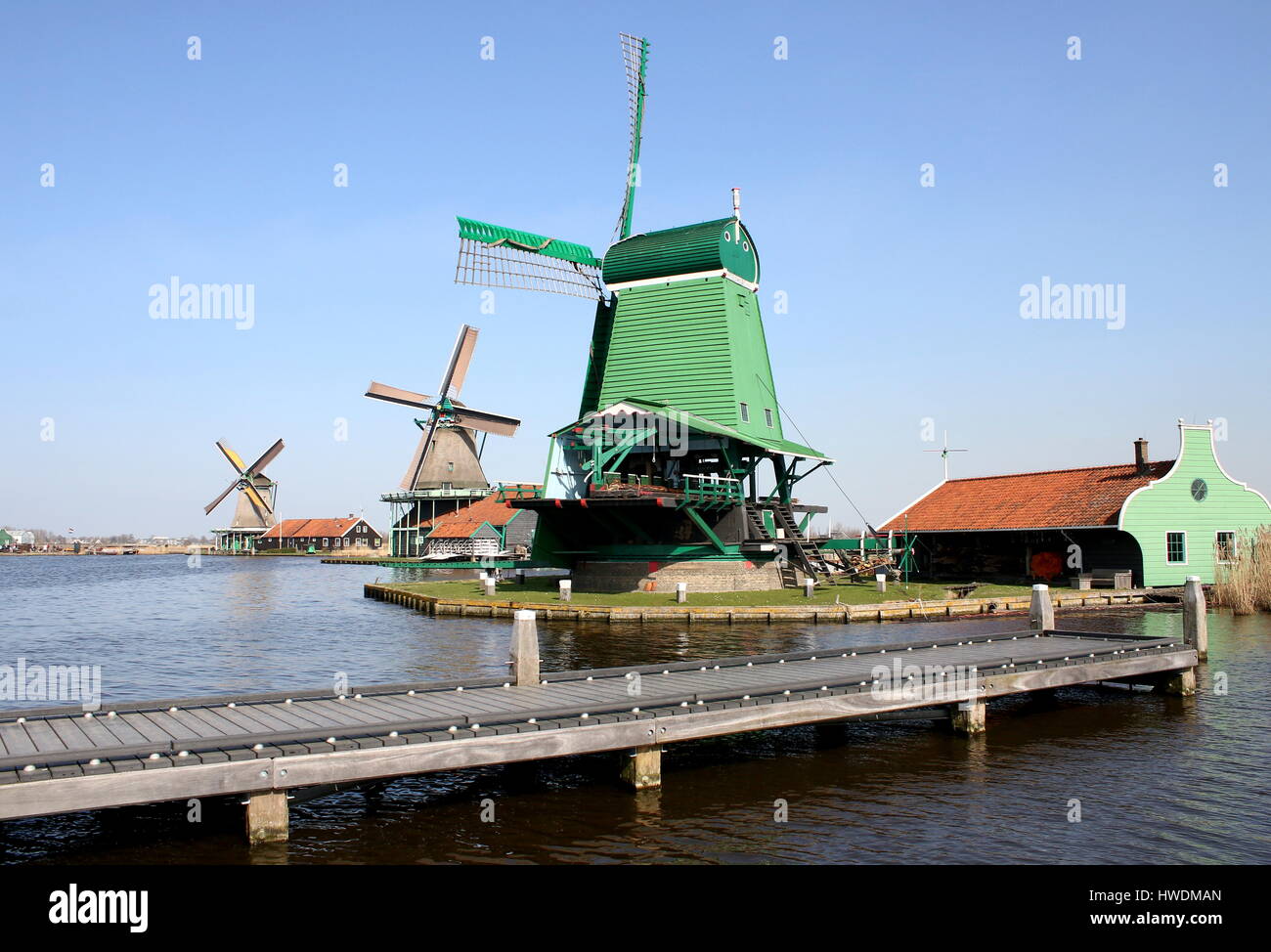 Three Windmills at Zaanse Schans, Zaandam / Zaandijk, Netherlands: De Gekroonde Poelenburg, De Kat, De Zoeker (from right to left) Stock Photo