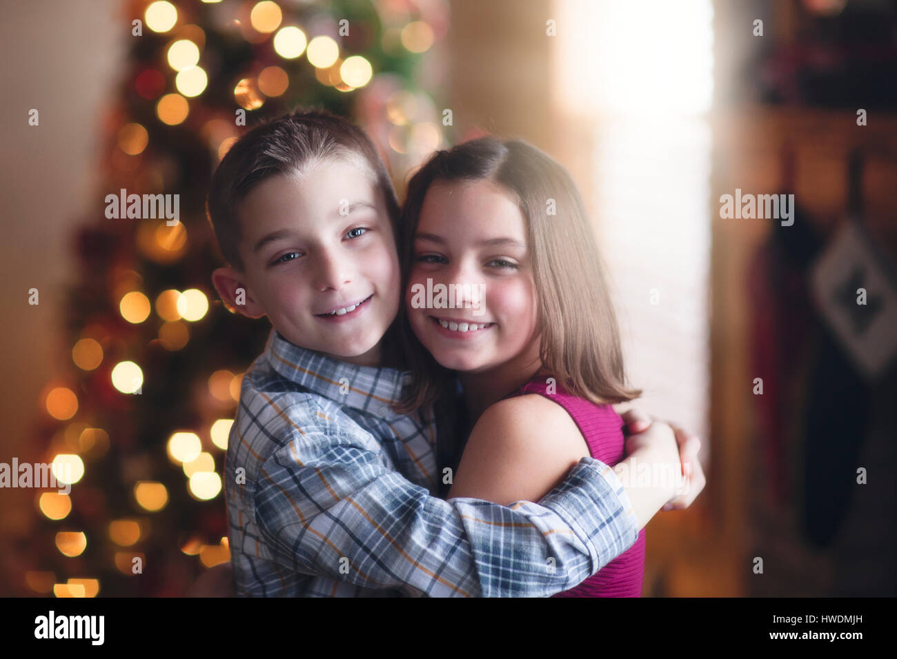 Portrait of brother and sister, hugging Stock Photo - Alamy