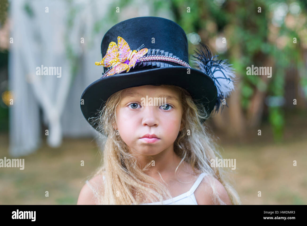 Portrait of young girl, wearing top hat Stock Photo