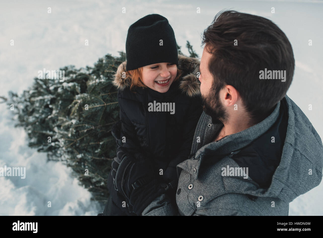 Father and daughter out getting their own Christmas tree Stock Photo