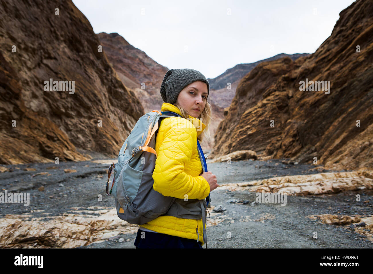 Trekker walking in Death Valley National Park, California, US Stock Photo