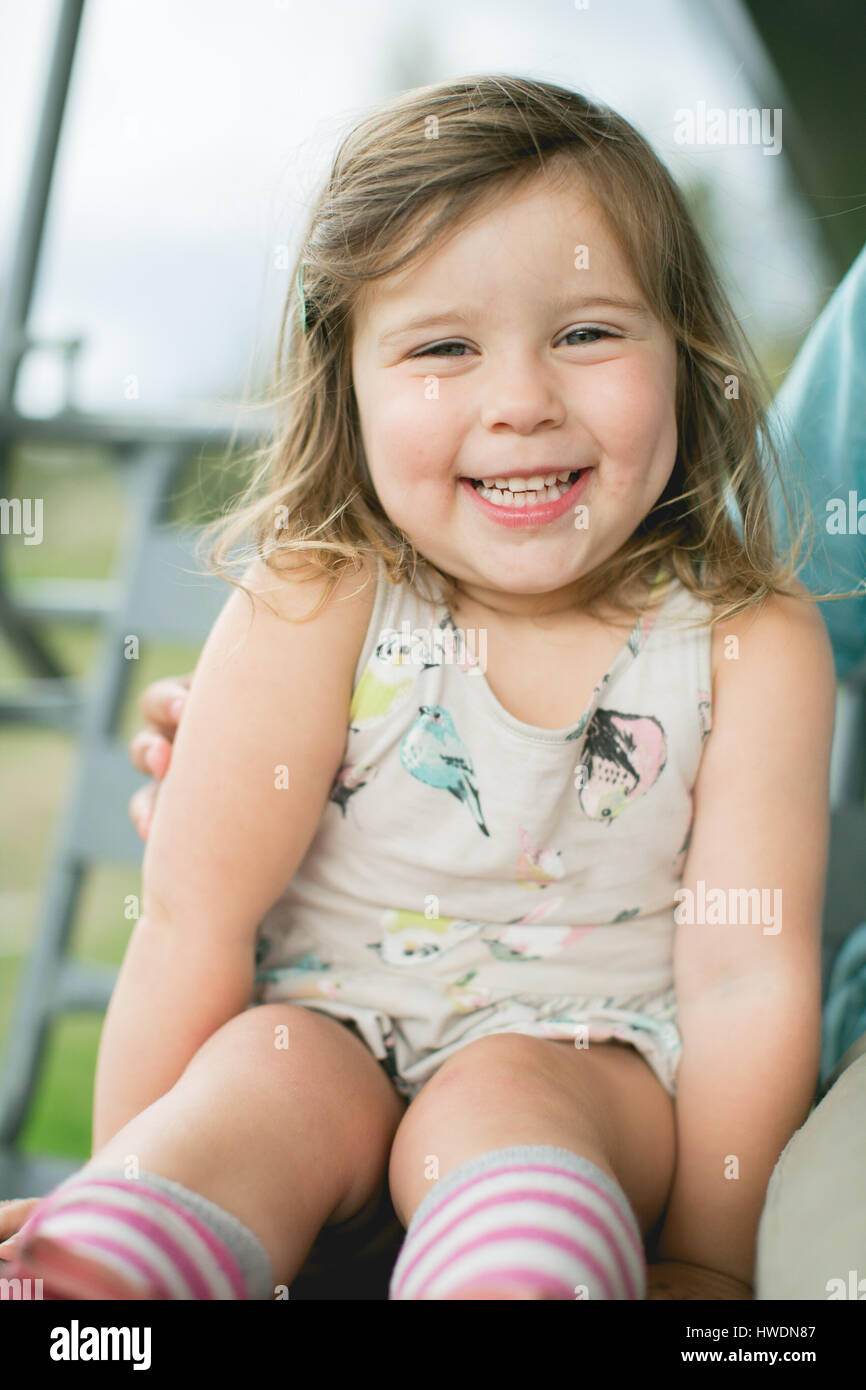 Portrait of happy girl looking at camera smiling Stock Photo - Alamy