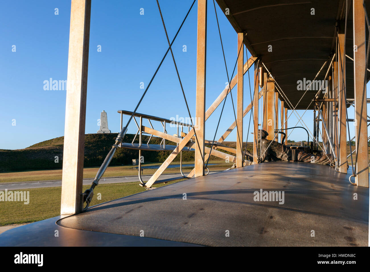 NC00666-00...NORTH CAROLINA - December 17, 1903 sculpture of the Wright Brothers histohic flight at Wright Brothers National Memorial in Kitty Hawk. Stock Photo