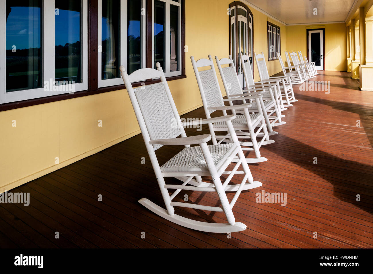 NC00697-00...NORTH CAROLINA - Rocking chairs on the porch of the Whalehead Club in the town of Corolla on the Outer Banks. Stock Photo