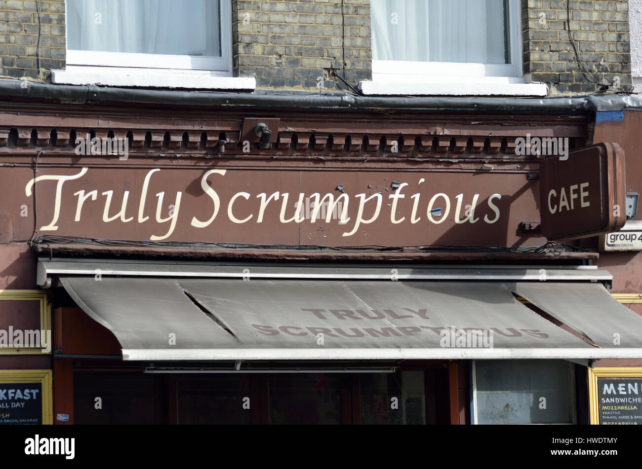 ’Truly Scrumptious’ sign outside a cafe restaurant in Camden Town, London, UK. Stock Photo