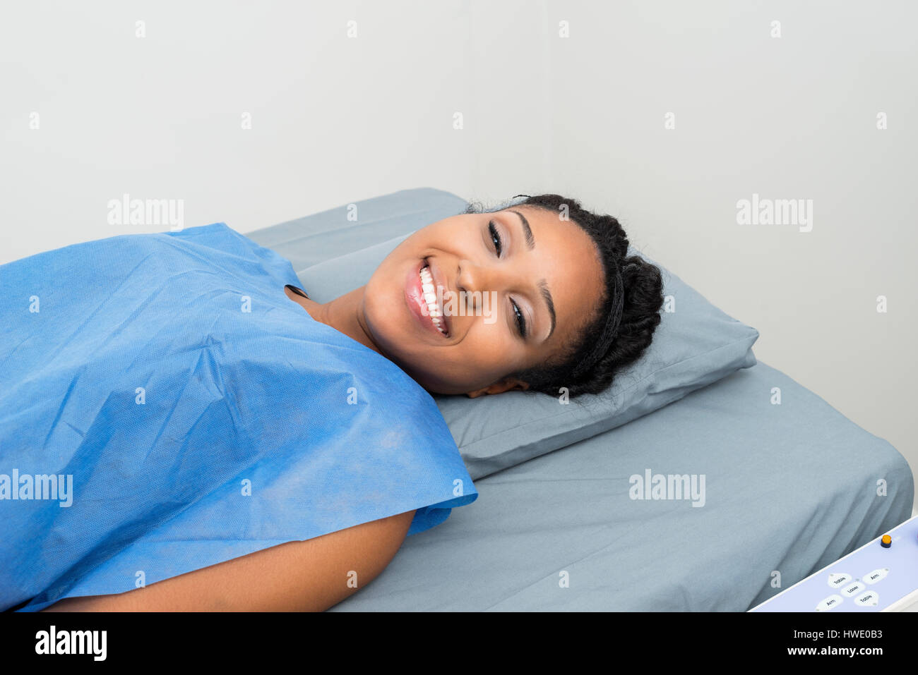 Happy patient lying on bed hi-res stock photography and images - Alamy