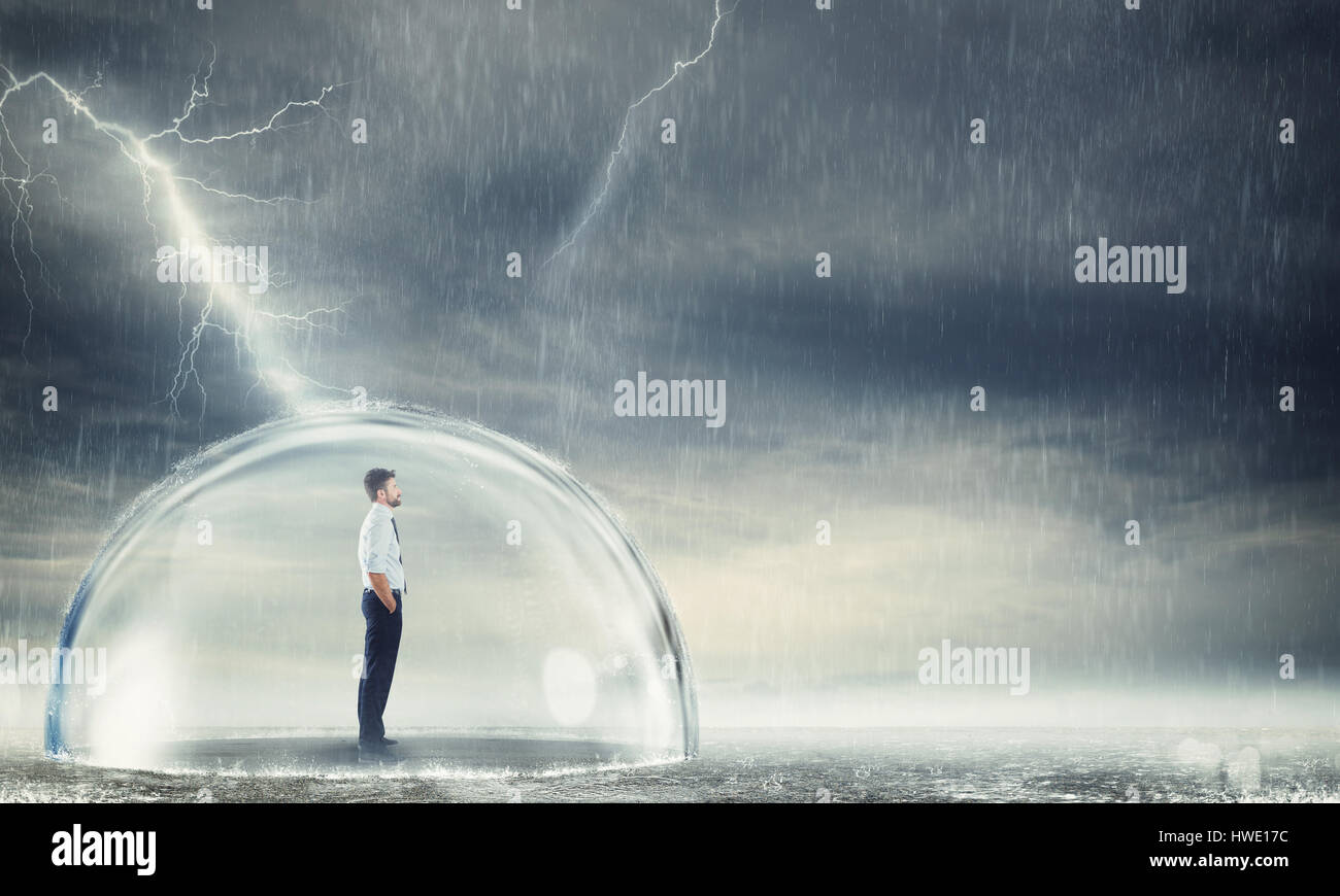 Businessman protected from the crisis Stock Photo