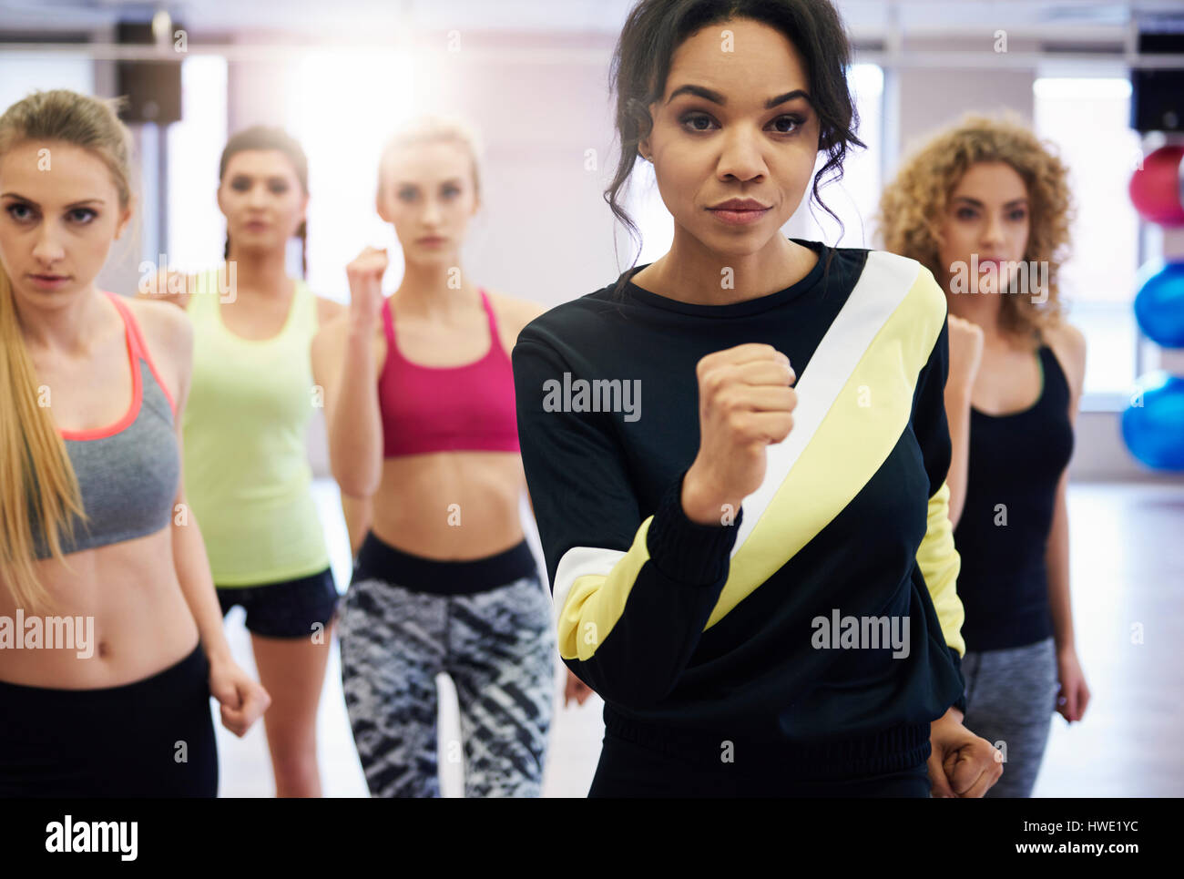 Five of women working hard in the gym class Stock Photo