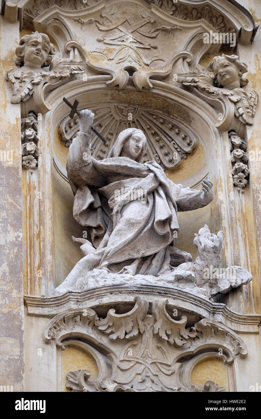 Statue of Saint Martha of Bethany on facade of Santa Maria Maddalena Church in Rome, Italy on September 05, 2016. Stock Photo