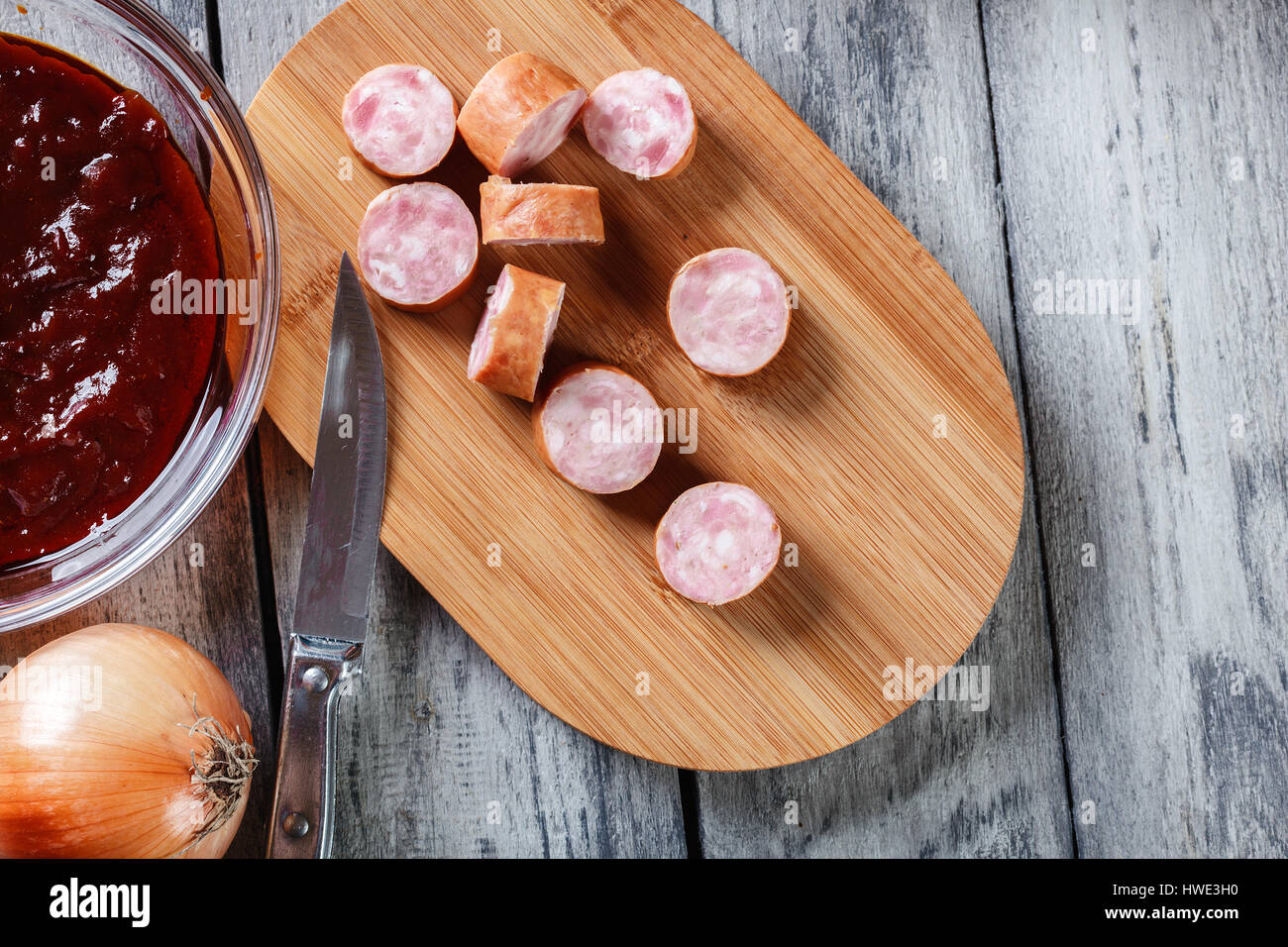 Ingredients ready for preparing German currywurst with curry sauce