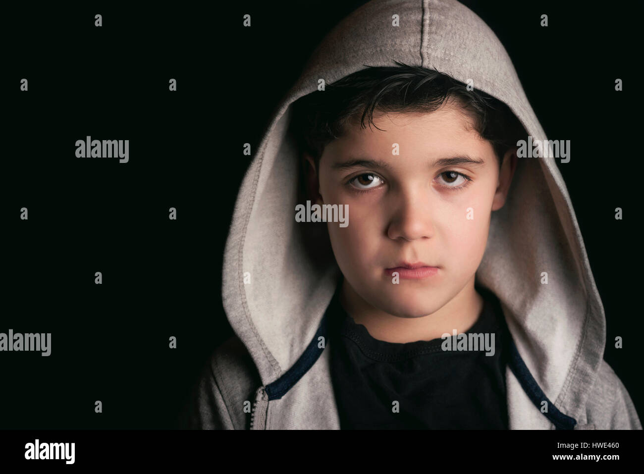 Sad boy on black background Stock Photo Alamy