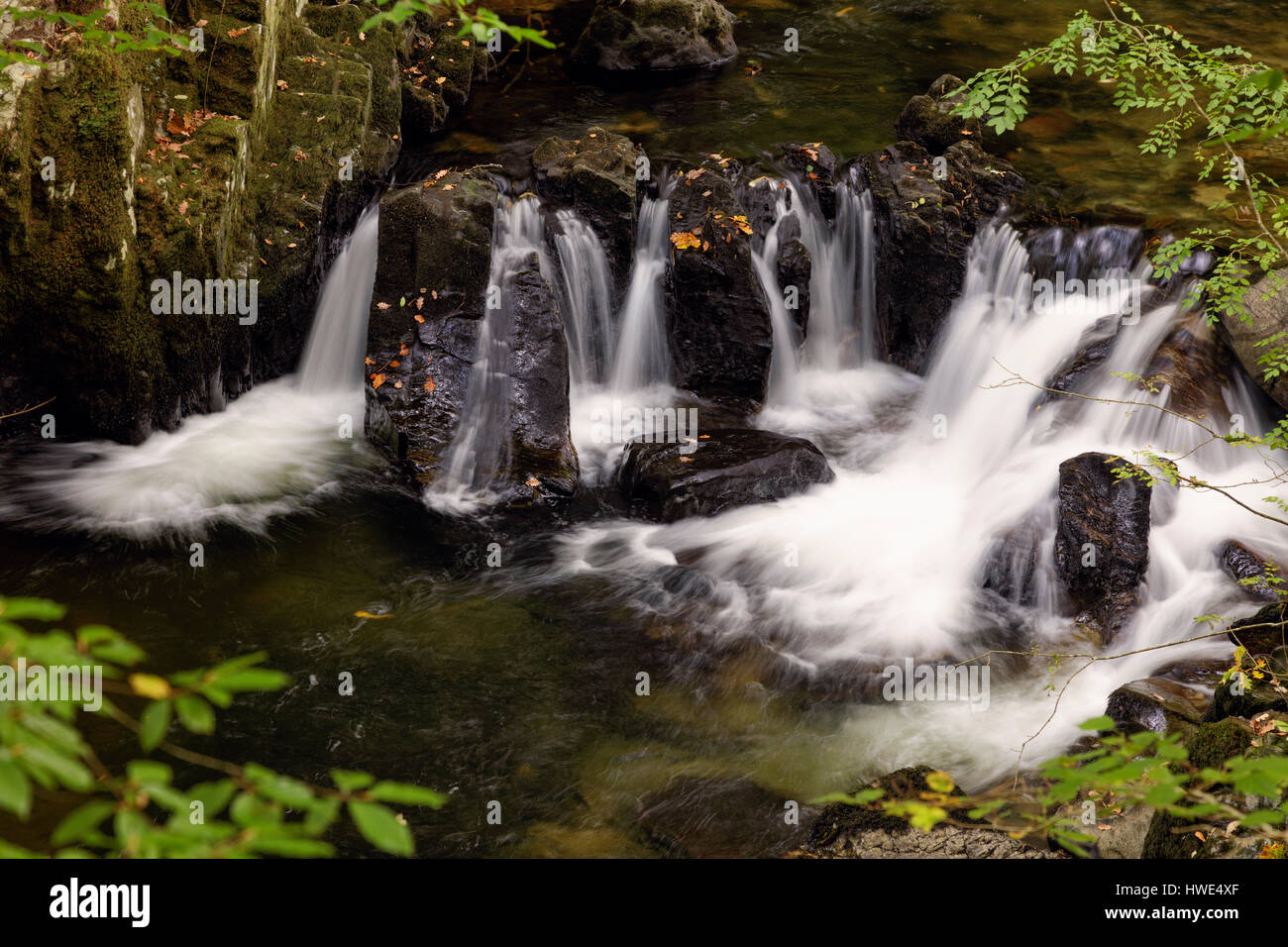 Close up detail of a small waterfall on the river Conwy at Betws-y-Coed in Snowdonia Stock Photo