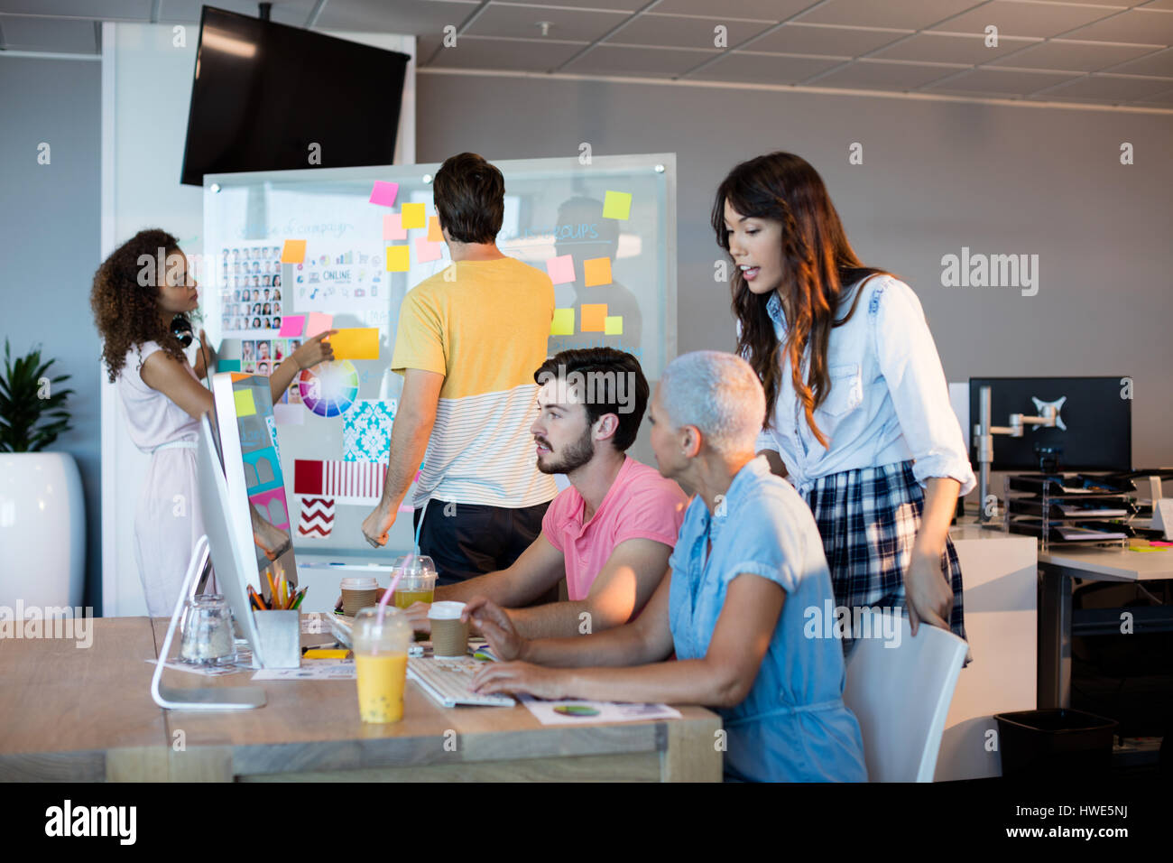 Creative business team working together at office Stock Photo - Alamy