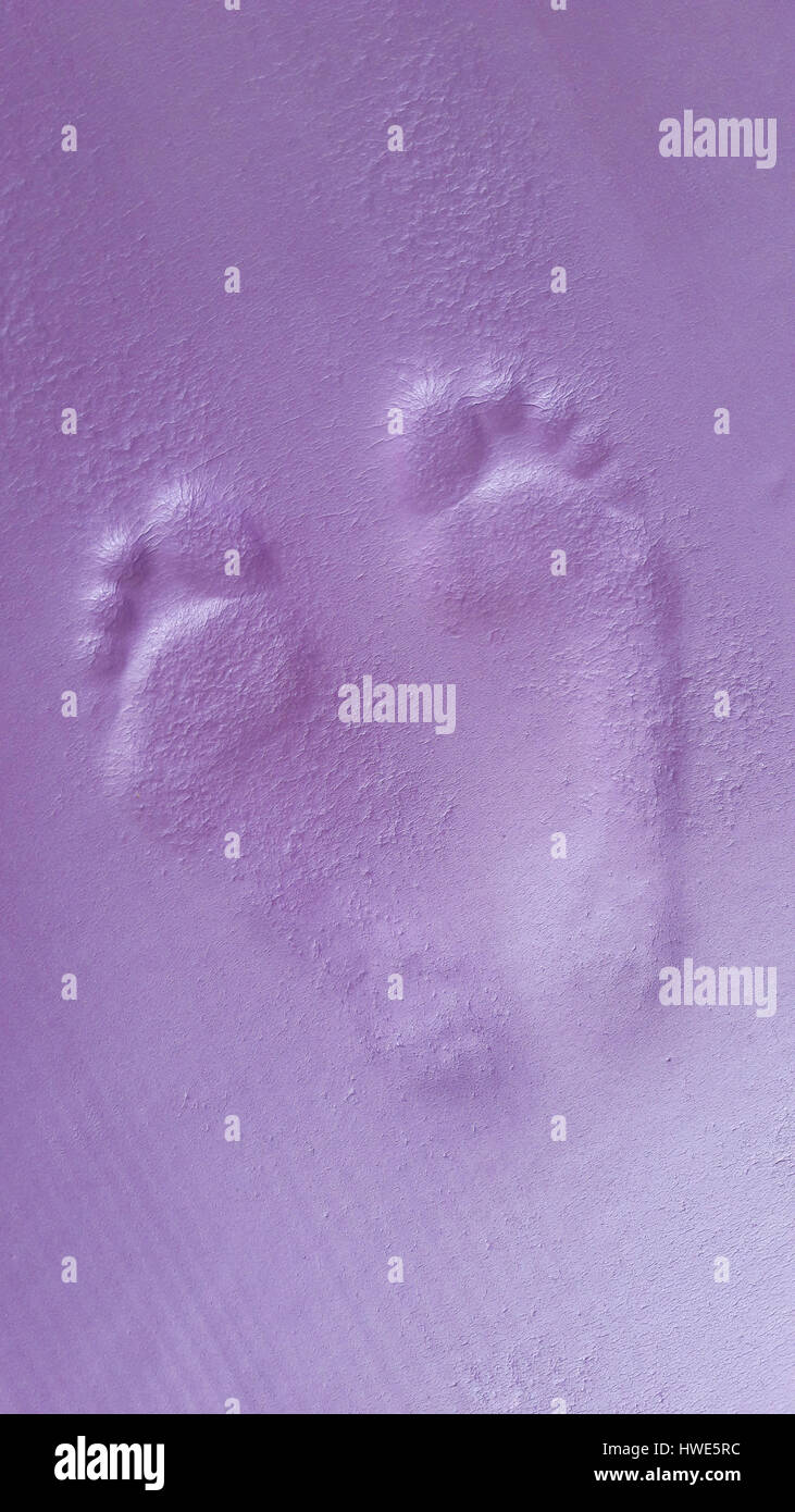 Feet impressions on yoga mat. Stock Photo