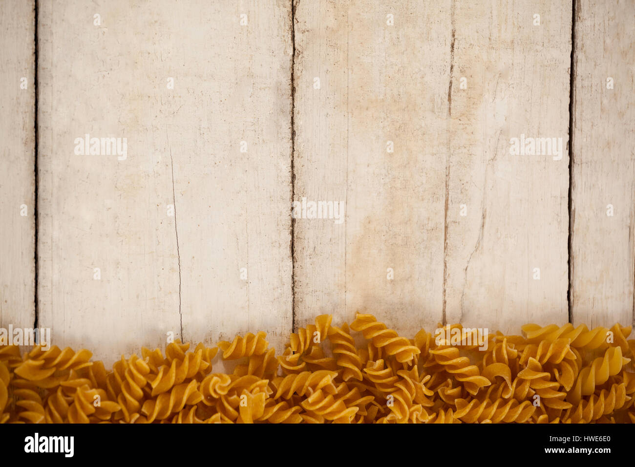 Girandole pasta isolated on wooden background Stock Photo