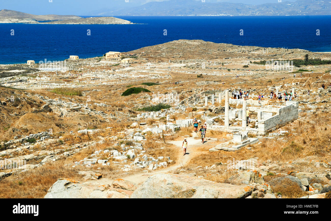 Tourists explore the mythological island of Delos, off the coast of Mykonos in the Greek Islands. Stock Photo
