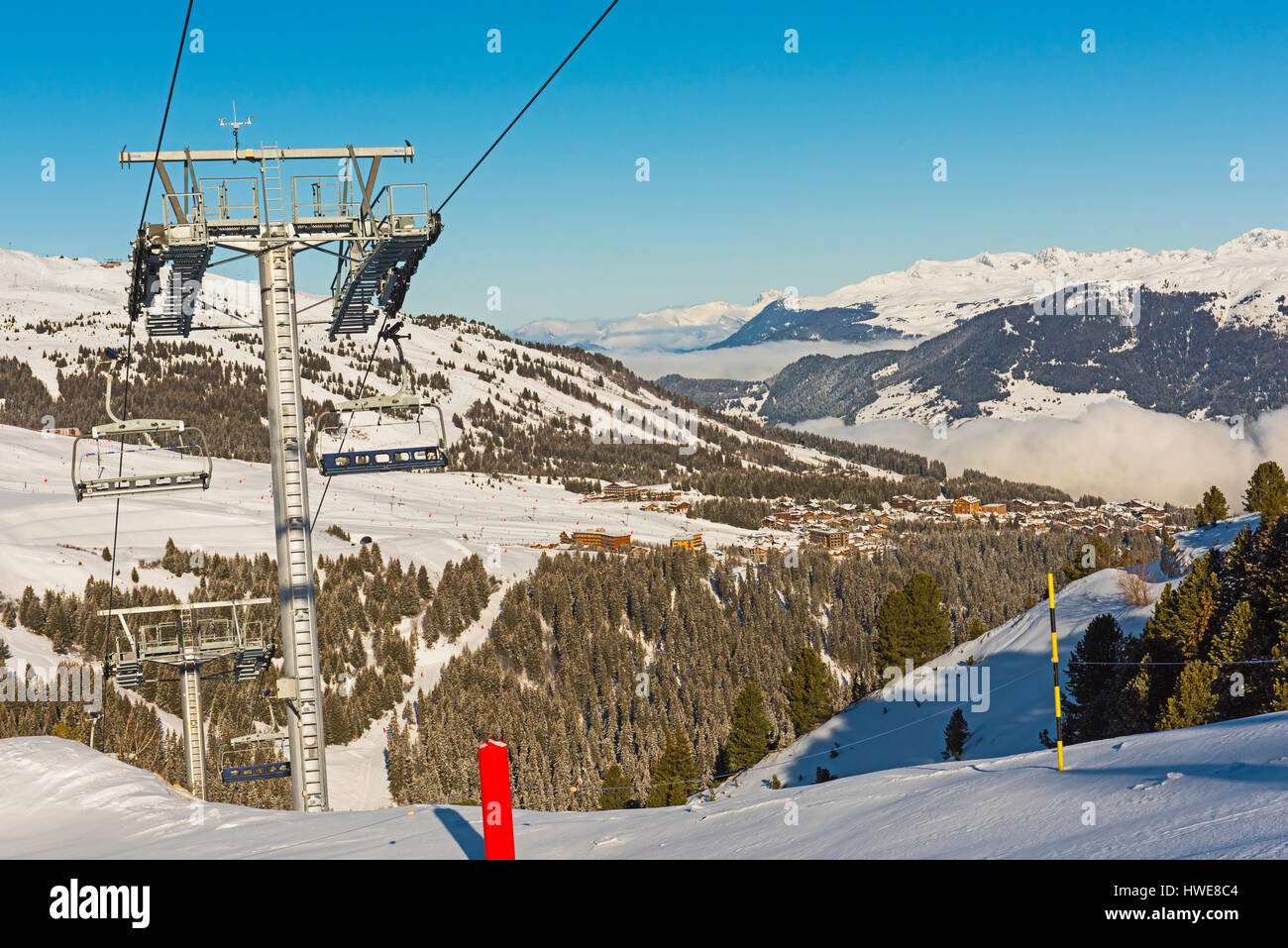 Premium Photo  Ski lift covered with frost above a sea of clouds in a ski  resort in tarentaise france