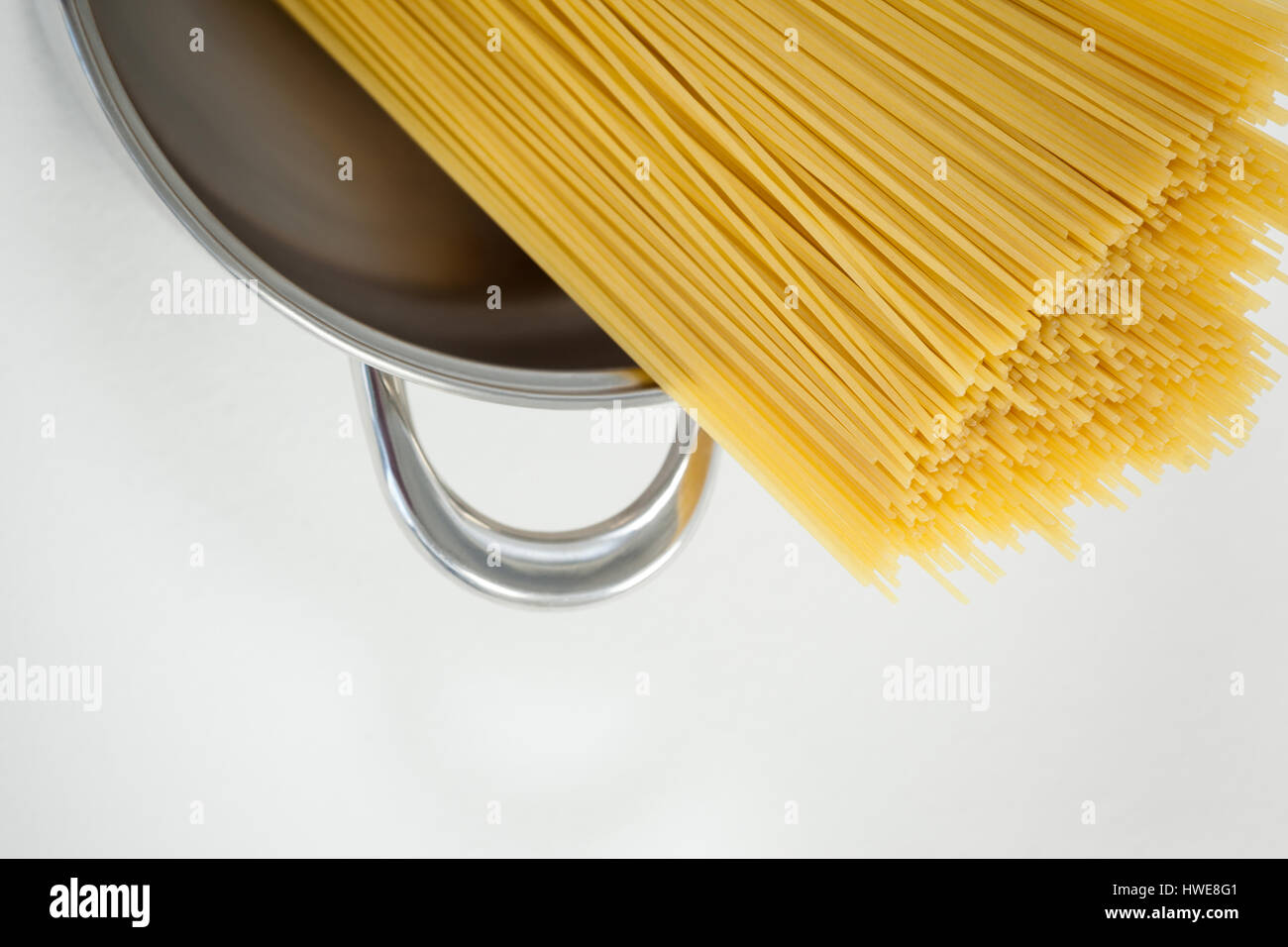 Spaghetti pasta in utensil on white background Stock Photo Alamy
