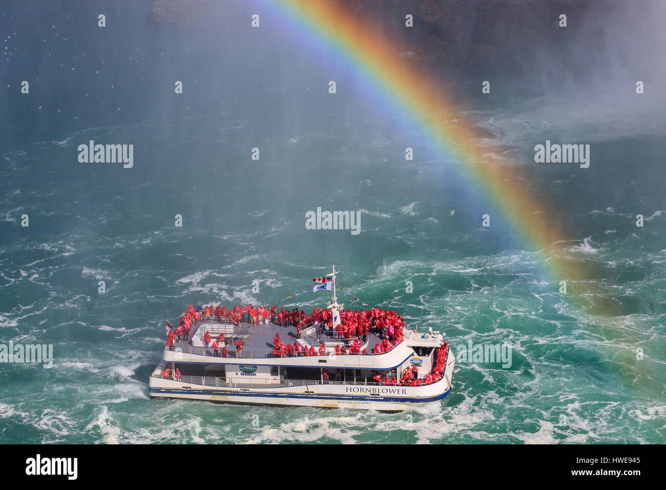 The Hornblower loaded with tourists entering the Horseshoe Falls, part of the Niagara Falls, Ontario, Canada. Stock Photo