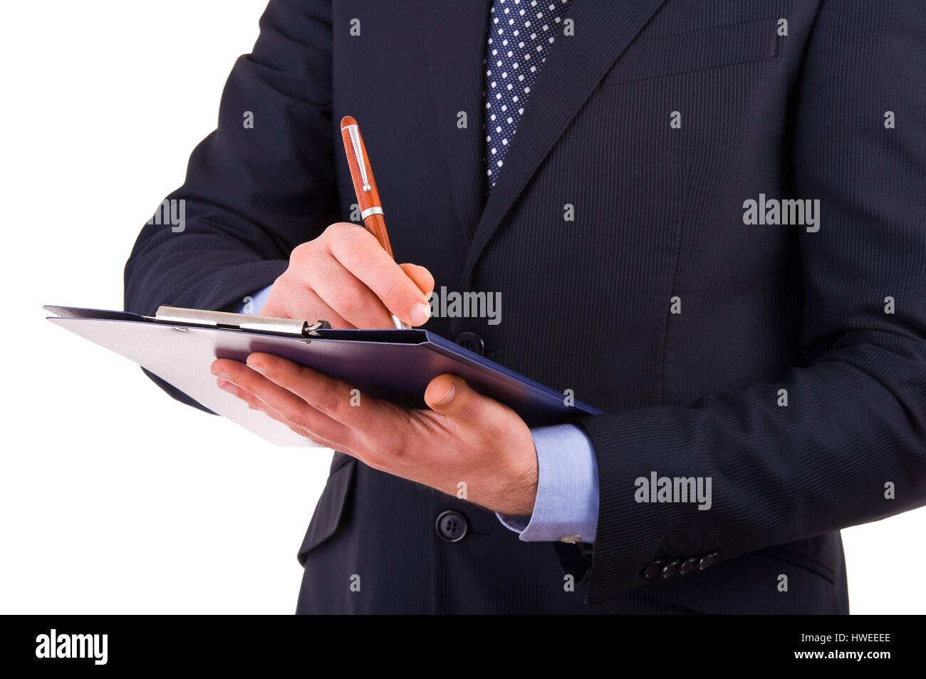 Businessman writing notes on clipboard Stock Photo - Alamy