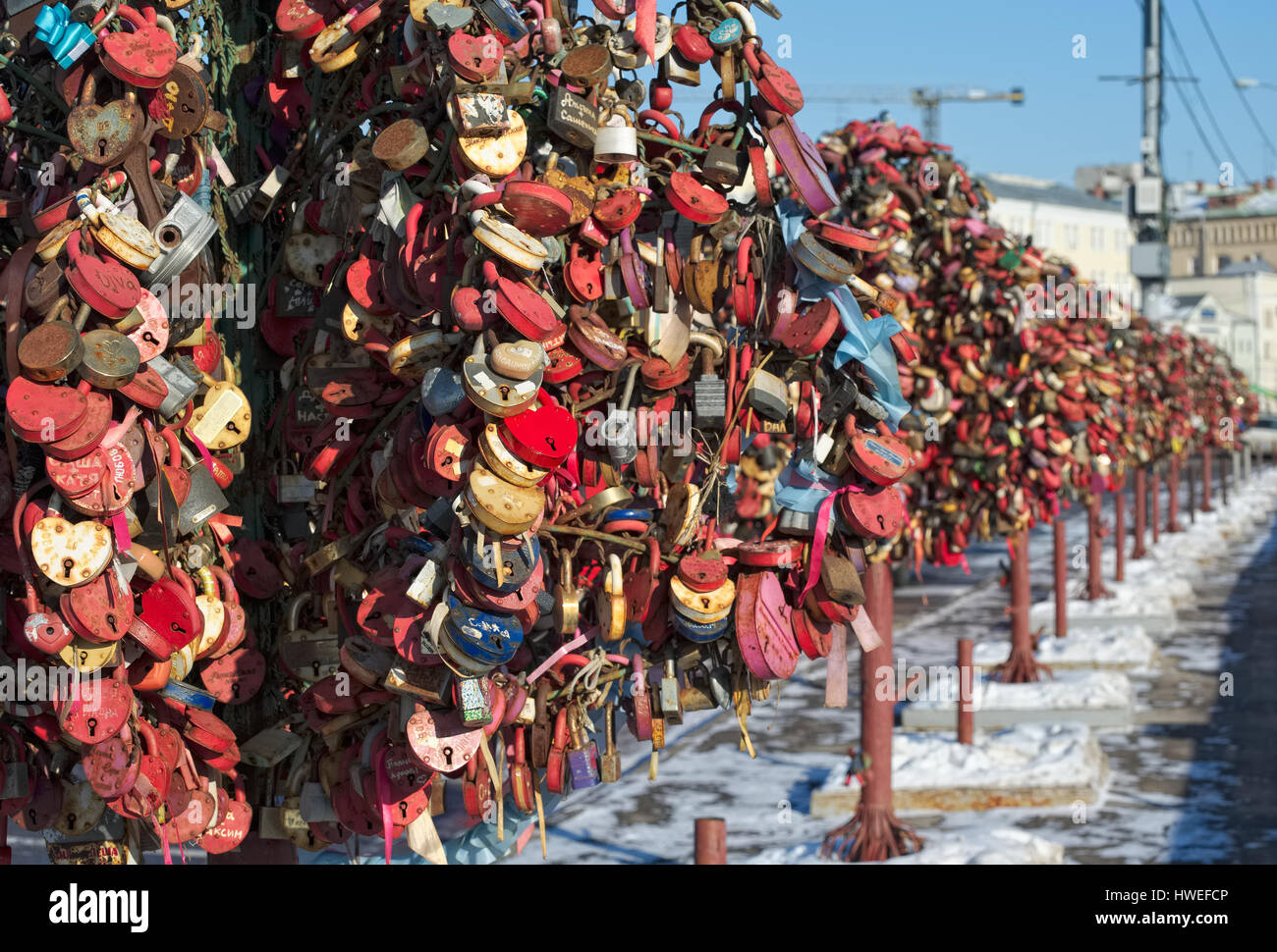 Avenue of Bridal trees from metal with closed locks of love on Bolotnaya embankment Stock Photo