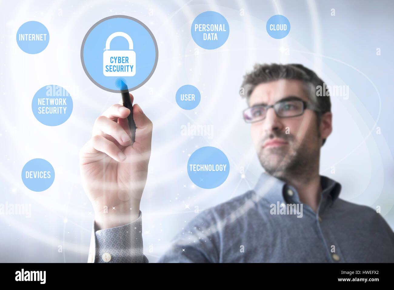man touching a virtual screen with cyber security app Stock Photo